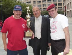 While the NYPD won the over all cumulative team distance Firefighter Jeff Ray walked away with the long ball trophy for the second year in a row.