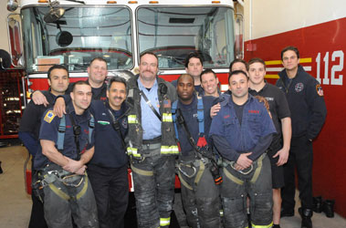 Firefighters from Engine 277/Ladder 112 (L to R) FF Milton Mendez, FF Manny Torres, FF Rory Allen, FF Benny Ortiz, Lt. Niels Jorgensen, FF Mike Ashby, FF Mark Loftus, FF Anthony Chaimowitz, FF Anthony Kennedy, FF Chris McKeon, FF Mike Nugent, FF Tom Boyce (detailed from Squad 252)