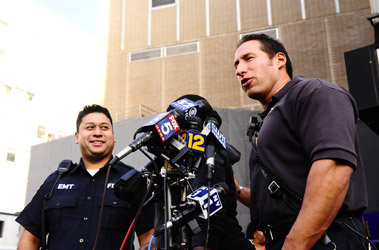 EMTs Frank Li (left) and Todd Bilgore describe how they saved the life of a 1-month-old baby boy.