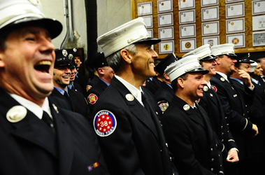 Active and retired firefighters and their families filled the apparatus floor to celebrate Engine 88/Ladder 38's centennial