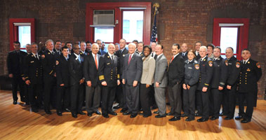 Chief of Department Salvatore Cassano and Commissioner Nicholas Scoppetta with donors and scholarship recipients at the New York City Fire Museum on April 3