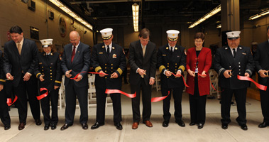 Members of the FDNY, Medical Examiner's Office and Dormitory Authority of the State of New York State cut the ceremonial ribbon officially opening the newly renovated EMS Station 8 in Manhattan.