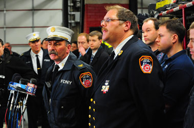Deputy Chief Paul Ferro (left) and Deputy Chief Howard Sickles describe how firefighters and EMS members were able to save four people from a fire in Queens.