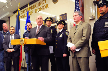Chief Robert Byrnes explains how the FDNY fire marshals and NYPD worked together to catch a serial arsonist on the Upper West Side of Manhattan. Behind him are Supervising Fire Marshal Sal Rignola (second from left), Fire Marshal Brian Kane (far left) and Fire Marshal John Watkins (third from left), as well as members of the NYPD.