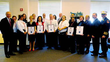 Fire Commissioner Nicholas Scoppetta and Chief of Department Salvatore Cassano thank Theresa Bishoff, CEO of the American Red Cross, and the organizations' many volunteers for their support during American Red Cross month.