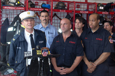 Members of Engine 239 after rescuing a man from the Gowanus Canal on May 9. (L to R) FF Darrell Couch, FF Frank Staiti from Engine 151, FF Richard Staiti, Capt. Edward Watt, FF Neil Malone, FF Robert Tomasulo, FF John Dearruda and Deputy Chief Michael Halderman of Div. 8.