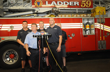 Firefighters from Ladder 59 speak to the media about their daring rescue.