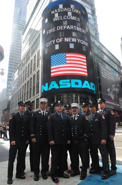 The 10 FDNY members honored by NASDAQ outside their offices in Times Square.