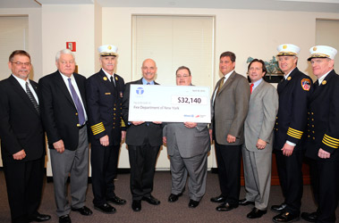 Members of Taylor & Taylor Assoc. and Fireman's Fund Insurance join FDNY members as they present the $32,000 grant. (L to R) Glenn Skrynecki, Vice President Fireman's Fund; Raymond Taylor, Chairman of the Board of Taylor & Taylor; Chief of Department Edward Kilduff; Fire Commissioner Salvatore Cassano; Terry McCormick, Territory Sales Executive at Fireman’s Fund; Scott Taylor, President of Taylor & Taylor Associates; Matt Miller, President of the Association of Independent Commercial Producers; Chief of Operations Robert Sweeney; and Chief of Training Thomas Galvin.
