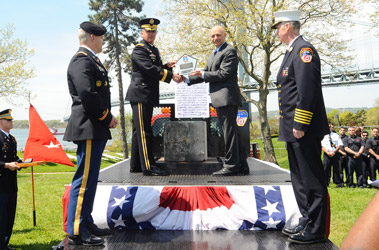 Major General Karl R. Horst presents the Pentagon stone and plaque to Fire Commissioner Salvatore J. Cassano