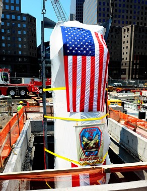 Ladder 3's apparatus is lowered into the 9/11 Memorial Museum by a crane.