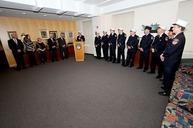Chief Kilduff addresses the crowd, which includes (L to R) Thomas Brick, Sr., Megan Brick, Margaret Brick, Salvatore Bommarito, Fire Commissioner Salvatore Cassano, Capt. Jason Cascone, Capt. Paul Conrad, Capt. James Duff, Capt. Matthew Egan, Capt. Mark Guerra, FF John McGinty, Lt. Christopher Reiser, FM Nelson Roman, and Capt. Kenneth Scanlon. (not pictured, FF Carlos Guzman).