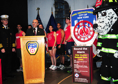 Fire Commissioner Salvatore Cassano speaks of the importance of changing the batteries in smoke and carbon monoxide detectors when the clocks change for Daylight Saving Time. He's joined by Chief of Department Edward Kilduff; Hot Dog, the FDNY's Fire Safety mascot; and members of the FDNY's Marathon team.
