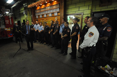 The Concilmember with the members of Engine 219, Ladder 105 and Rescue 2.