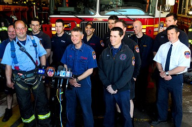 Firefighters from Ladder 107 (L to R in front row: Lt. Gerard Cox, FF John Bunning and FF James Goelz) describe their rescue to the media.