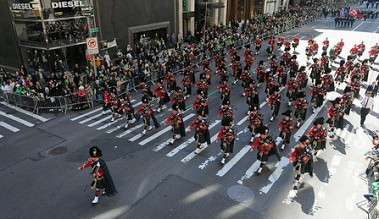The Emerald Society Pipes and Drums Band marching in the St. Patrick's Day Parade