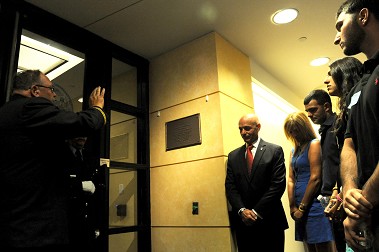 FDNY Chaplain Monsignor John Delendick blesses FM Steve Mosiello's plaque at FDNY Headquarters beside Fire Commissioner Salvatore Cassano and the Mosiello family.