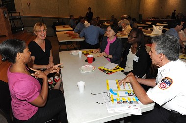 Lt. Anthony Mancuso, the FDNY's Fire Safety Education Director, takes part in one of the discussion groups during the session with members of the deaf and hearing impaired community.
