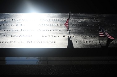 Family and friends left flowers and flags at the National Sept. 11 Memorial in Lower Manhattan on the 11th anniversary of the terror attacks.