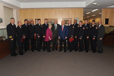 Fire Commissioner Salvatore Cassano, Salvatore Bommarito and the Brick family with the 2012 scholarship winners.