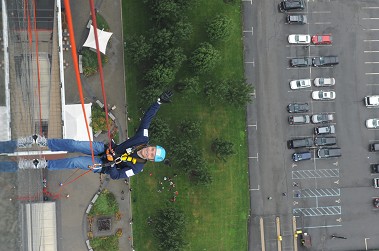 Fire Commissioner Salvatore Cassano starts rappelling approximately 40 stories for the American Cancer Society's Over the Edge challenge.