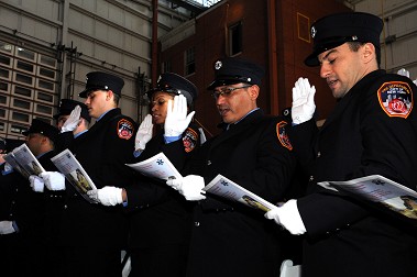 New paramedics and EMTs take the Oath of Geneva.