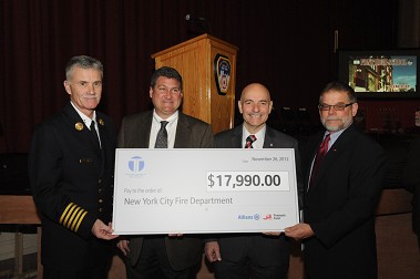 (L to R): Chief of Department Edward Kilduff; President of Taylor & Taylor Associates, Scott Taylor; Fire Commissioner Salvatore Cassano; Vice President of Fireman's Fund, Glenn Skrynecki