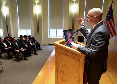 Fire Commissioner Salvatore Cassano speaks to the group about fire safety.