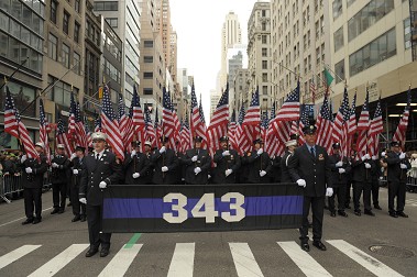 FDNY members carry 343 flags, representing the members who died at the World Trade Center in 2001, in the 2013 St. Patrick's Day Parade.