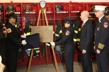 The centennial plaque is unveiled.