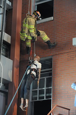 FDNY Rescue Paramedic Juan Henriquez demonstrates how they can treat a victim for injuries during a high-angle rescue.