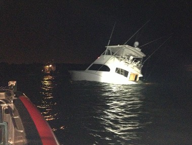 View off Marine 3 when firefighters returned after rescuing all five passengers off the sinking boat.