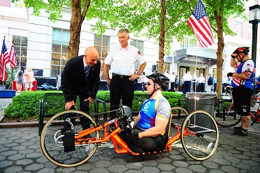 Fire Commissioner Salvatore Cassano and Chief of Department Edward Kilduff speak with one of the Wounded Warriors.