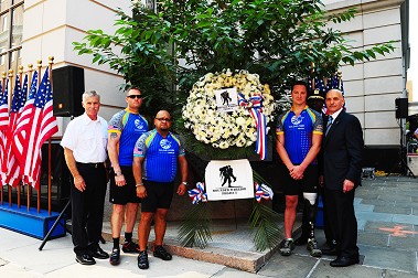 Fire Commissioner Salvatore Cassano and Chief of Department Edward Kilduff join the Wounded Warriors in laying a wreath at the 9/11 monument outside FDNY Headquarters in Brooklyn.
