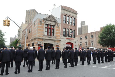 Firefighters outside the firehouse for the centennial.