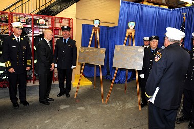 The centennial plaques are blessed.