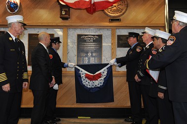 A plaque is unveiled marking the centennial of Ladder 43