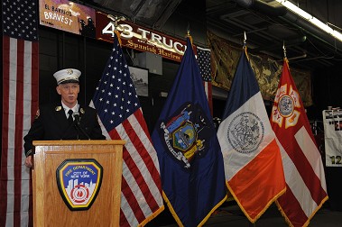Capt. Ray Farrell, Ladder 43, addresses the crowd, calling the fire company 