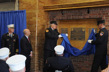 The centennial plaque is unveiled.