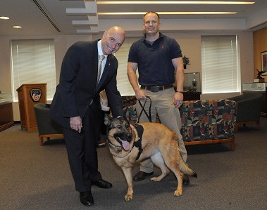 Fire Commissioner Salvatore Cassano (left) with Gunnery Sgt Chris Willingham and Lucca.
