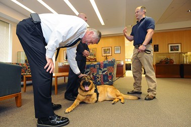 Chief of Department Edward Kilduff pets Lucca.