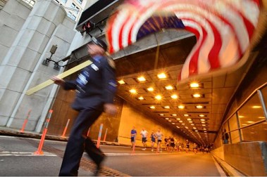 FDNY members line the race through the Tunnel.
