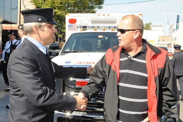 Iron Worker John Stalzer (right) is greeted by one of his rescuers, Rescue Paramedic Brian Frayne.