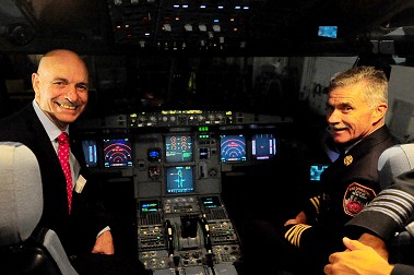 Fire Commissioner Salvatore Cassano and Chief of Department Edward Kilduff in the cockpit of the new FDNY-themed plane.