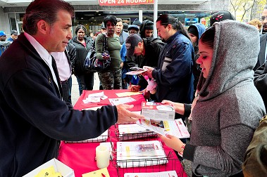 Lt. John Errico from the Fire Safety Education Unit explains critical fire safety education information at a location in the Bronx. He is one of many educators reaching out to the public in the wake of several fatal fires in homes without working smoke alarms.