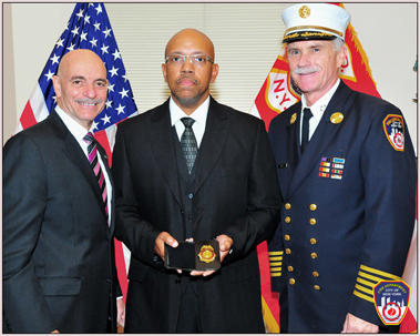 Rev. V. Simpson Turner with Fire Commissioner Salvatore Cassano and Chief of Department Edward Kilduff after he was sworn in.