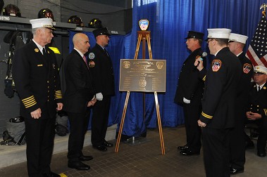 A plaque is unveiled to honor Ladder 47's centennial.