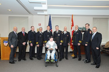 Honorary Firefighter Seth Kelly with members of the FDNY.