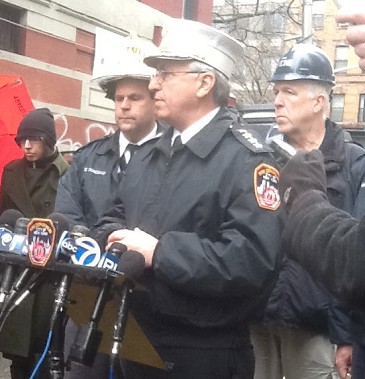 Chief of Operations James Esposito talks to the media about high-rise fire safety.