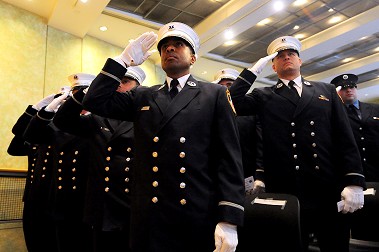 The newly promoted lieutenants and graduating paramedics during the ceremony.